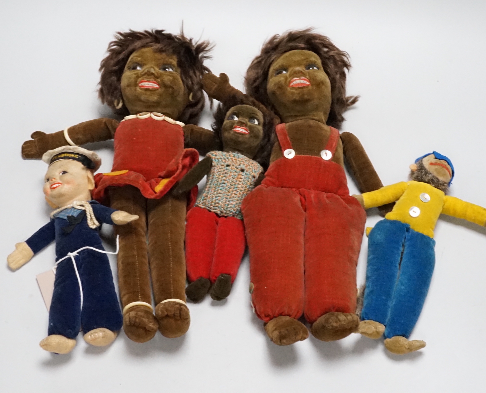 Five Norah Wellings soft toys including three South Sea Islanders, a sailor boy and a monkey, all with labels, monkey 23cm high